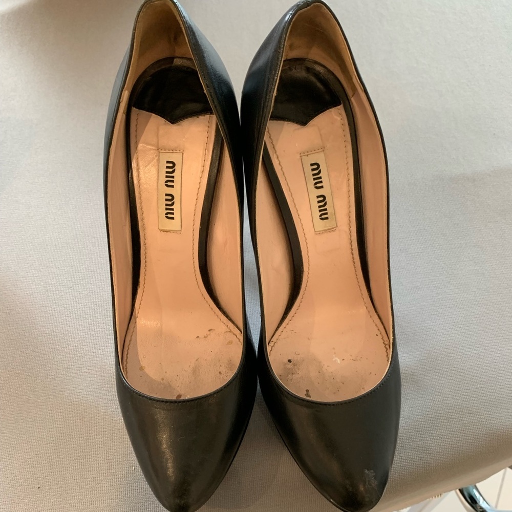 Mui Mui designer black platform heel.